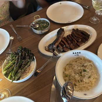 Rare Society - 35 Day Dry Aged Bone in Ribeye, Wood Fired Broccolini, and Fettuccine Alfredo - Steakhouses Near Me - Las Vegas, Nevada Rare Society - 35 Day Dry Aged Bone in Ribeye, Wood Fired Broccolini, and Fettuccine Alfredo - Steakhouses Near Me - Las Vegas, Nevada