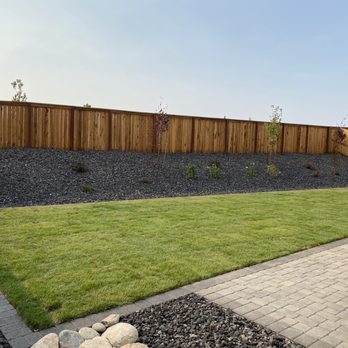 Navarro Landscaping - a backyard with a wooden fence - Landscaping Near Me Navarro Landscaping - a backyard with a wooden fence - Landscaping Near Me