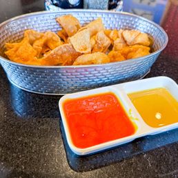 Free fried wonton strips with sweet and sour sauce and spicy mustard. Free fried wonton strips with sweet and sour sauce and spicy mustard.