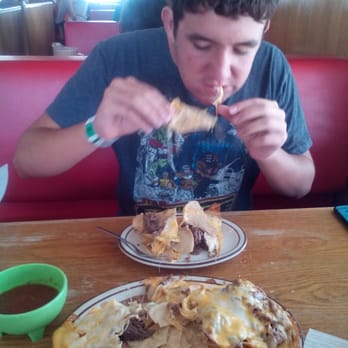 El Tapatio - Max attacking the nachos! - Mexican Near Me - Porterville, California El Tapatio - Max attacking the nachos! - Mexican Near Me - Porterville, California