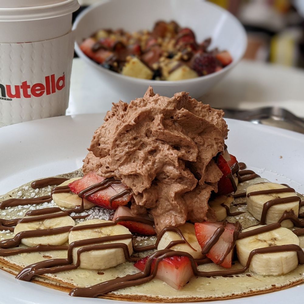 Nutella Cafe - Crepe with bananas, strawberries and Nutella whipped cream - Desserts Near Me - Chicago, Illinois