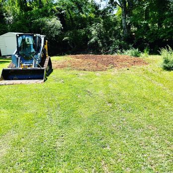Xtreme Dirt WorX - Pushing over some stumps that was grounded up in a pile. - Landscaping Near Me Xtreme Dirt WorX - Pushing over some stumps that was grounded up in a pile. - Landscaping Near Me