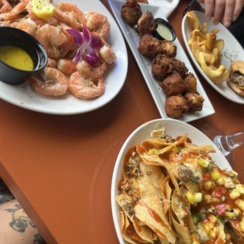 Riptides Raw Bar & Grill - Peal and Eat Shrimp Hush puppies  Caribbean Chicken Nachos - Seafood Near Me - Ormond Beach, Florida