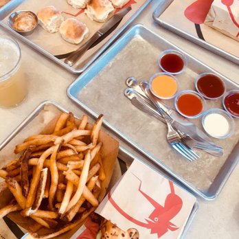 The Crack Shack - Shared spread: Biscuits, Señor Croque, Firebird, Schmaltz Fries, and dipping sauces - New American Near Me - Encinitas, California