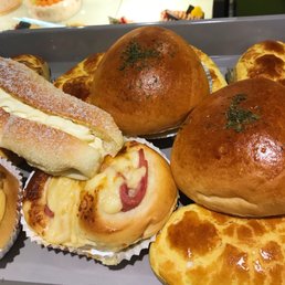 Assortment of buns: curry beef, pineapple w/coconut filling, ham & cheese, coconut buttercream, and pineapple with char siu filling