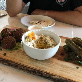 Ammatoli - Ammatoli Mezza Combo part 1. From left: falafels, labne, and grape leaves. - Mediterranean Near Me - Long Beach, California