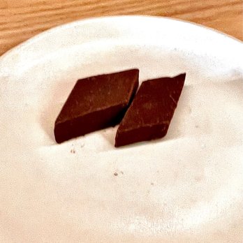 Tomo - Dark Chocolate and Coconut Oil treat at the end of our meal - New American Near Me - Seattle, Washington Tomo - Dark Chocolate and Coconut Oil treat at the end of our meal - New American Near Me - Seattle, Washington