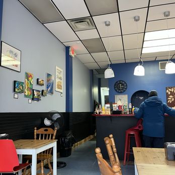 Fener’s Place  -  a person sitting at a table - Middle Eastern Near Me - Sackville, New Brunswick
