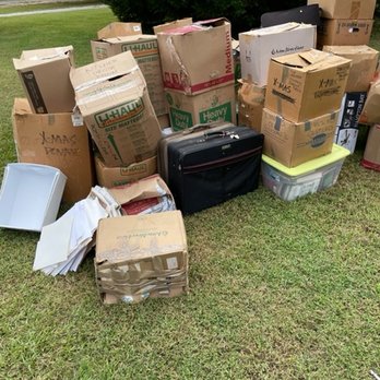 Two Men and a Truck Moving - Boxes strewn haphazardly on the lawn when there was a storage building 90 feet away. - Movers Near Me - Irwindale, California Two Men and a Truck Moving - Boxes strewn haphazardly on the lawn when there was a storage building 90 feet away. - Movers Near Me - Irwindale, California