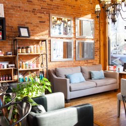 Urban Loft Salon - Warm and relaxing waiting area.