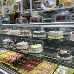 a display of cakes and pastries a display of cakes and pastries