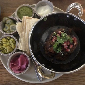 Byblos - Roasted Lamb Shoulder for Two slow braised lamb + sumar + pickled + house lavash - Mediterranean Near Me - Toronto, Ontario Byblos - Roasted Lamb Shoulder for Two slow braised lamb + sumar + pickled + house lavash - Mediterranean Near Me - Toronto, Ontario