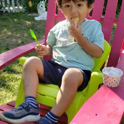 Moo Moo’s Ice Cream Shop - Chairs for everyone in  a spacious garden.   Those little  green Andirondack chair are perfect for kids.
