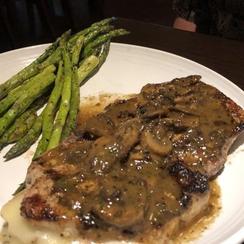 Carrabba's Italian Grill - Stuffed pork chop special. With asparagus. $26. This was really good. Hubs agreed to give me one but I was too full, and had just one bite - Italian Near Me - Shreveport, Louisiana Carrabba's Italian Grill - Stuffed pork chop special. With asparagus. $26. This was really good. Hubs agreed to give me one but I was too full, and had just one bite - Italian Near Me - Shreveport, Louisiana