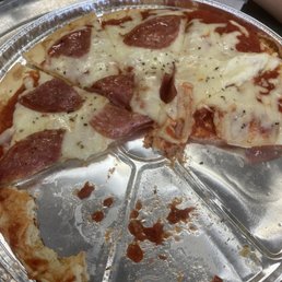 half eaten pepperoni pizza half eaten pepperoni pizza