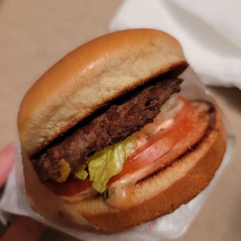 In-N-Out Burger - ows a hand holding a hamburger - Burgers Near Me - Mesa, Arizona In-N-Out Burger - ows a hand holding a hamburger - Burgers Near Me - Mesa, Arizona