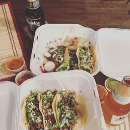 a variety of tacos and drinks