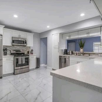 Top Remodeling - a kitchen with stainless steel appliances - General Contractors Near Me - Bellevue, Washington Top Remodeling - a kitchen with stainless steel appliances - General Contractors Near Me - Bellevue, Washington