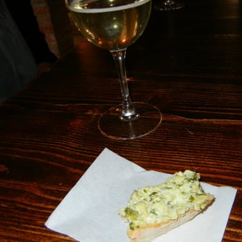 Venice Urban Adventures - One of the cicchetti we sampled, herbed cheese on bread, with a glass of local prosecco. - Tours Near Me - Venezia, VE