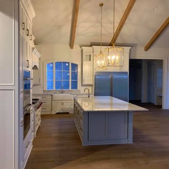 Coastal Homebuilders - a kitchen with a large island - Cabinetry Near Me - Houma, Louisiana
