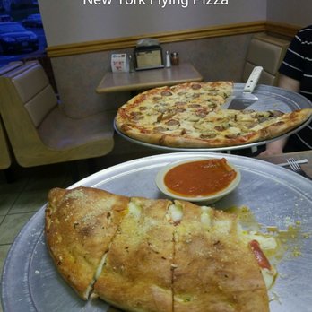 New York Flying Pizza - two people sitting at a table - Pizza Near Me - Staunton, Virginia