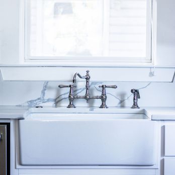 Spire Contracting - a kitchen with a sink and a window - Roofing Near Me - North Charleston, South Carolina