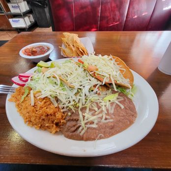 El Amigo - Three shredded beef tacos inside homemade fried taco shells, rice and beans. - Mexican Near Me - Lawndale, California