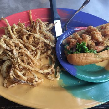 Sanford's Grub & Pub - Crawfish PO-Boy with onion strings. - Pubs Near Me - Casper, Wyoming