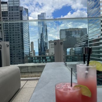Aire Rooftop Bar - Short glass: watermelon Margarita Tall: Tropical Collins - Wine Bars Near Me - Chicago, Illinois Aire Rooftop Bar - Short glass: watermelon Margarita Tall: Tropical Collins - Wine Bars Near Me - Chicago, Illinois