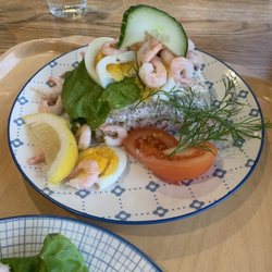 Toftastrand Villa Vik - Layered open faced sandwich with shrimp, cucumbers, hard boiled egg, and tuna salad.