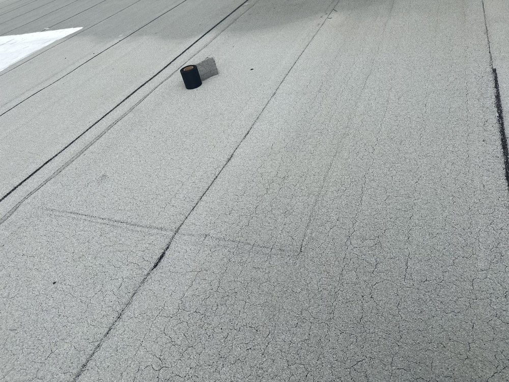 Slide of New Era Roofing