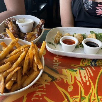 Cheeseburger In Paradise - Chicken wings and fries plus pot stickers - Burgers Near Me - Honolulu, Hawaii