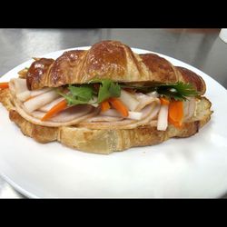 Knead Donuts & Vietnamese Coffee - Knead-Style Turkey Bánh Mì Croissant with house mayo, pickled daikon and carrots, and fresh cilantro.