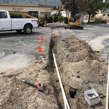 Mountain Top Lawn Care - installation of commercial sprinkler system across parking lot. - Irrigation Near Me Mountain Top Lawn Care - installation of commercial sprinkler system across parking lot. - Irrigation Near Me