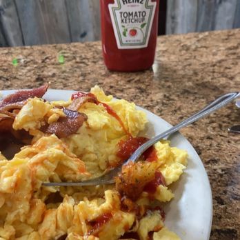 Thread City Diner - a plate of scrambled eggs and hash browns with ketchup and ketchup - Diners Near Me - Willimantic, Connecticut