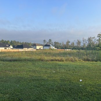 Sydes Construction - Over grown common space that is supposed to be maintained by the HOA - General Contractors Near Me - Jacksonville, North Carolina