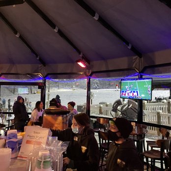 Massanutten Base Camp - a group of people sitting at tables - Bars Near Me - Massanutten, Virginia