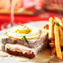 Marseille - Croque Madame - griddled bistro ham & gruyere on brioche topped with mornay and a sunnyside up egg, chips
