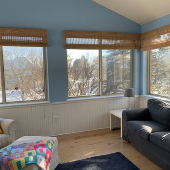 Jenkins Interiors - This sunroom basks in light thanks to the vibrant shade of Lake Blue - Painters Near Me