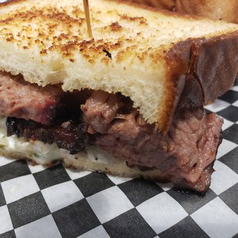 The Thumb - sliced brisket sandwich, close up - Barbeque Near Me - Scottsdale, Arizona The Thumb - sliced brisket sandwich, close up - Barbeque Near Me - Scottsdale, Arizona