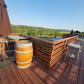 Chrysalis Vineyards - a wooden deck with a wine barrel - Wine Tasting Room Near Me - Middleburg, Virginia Chrysalis Vineyards - a wooden deck with a wine barrel - Wine Tasting Room Near Me - Middleburg, Virginia