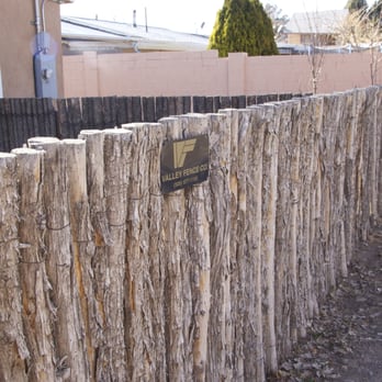Valley Fence - a wooden fence with a sign on it - General Contractors Near Me - Albuquerque, New Mexico