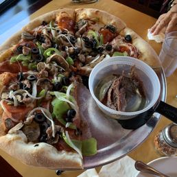 Combination Pizza with a side of anchovies