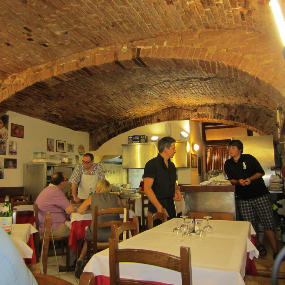 Trattoria La Torre - Inside the restaurant.  The kitchen area is in the background. - Italian Near Me - Siena, SI