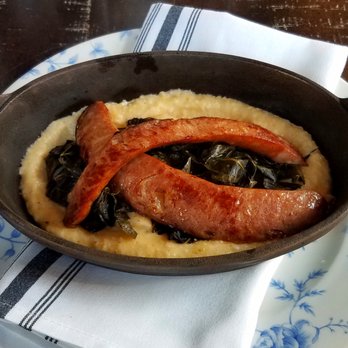 The Restaurant at Charmant - Grits (Andouille Sausage, Collard Greens, Cheddar Cheese) - French Near Me - La Crosse, Wisconsin