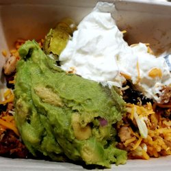 Chicken Burrito Bowl with Mexican Rice, Black Beans, jalapeños, sour cream and Guacamole. Delicious and filling.