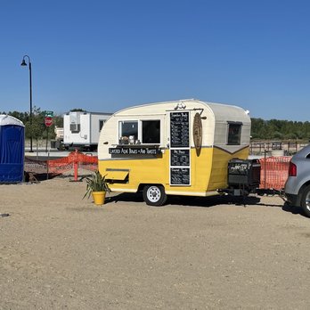 Just Bee Acai - a yellow and white camper trailer - Food Trucks Near Me