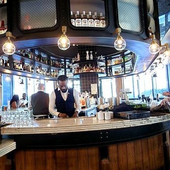 Yardbird - The bar at the front as you walk in. - New American Near Me - Washington, DC, District of Columbia