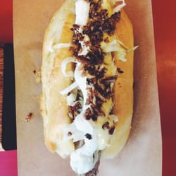Pølsekompagniet - The Nordic pølser with cabbage, horseradish and bacon bits atop a sausage dog in a fantastisk bun.