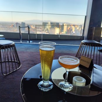 Skyfall Panoramic Bar & Lounge - Cocktail and a beer with the view from the lounge area. - Cocktail Bars Near Me - Las Vegas, Nevada Skyfall Panoramic Bar & Lounge - Cocktail and a beer with the view from the lounge area. - Cocktail Bars Near Me - Las Vegas, Nevada